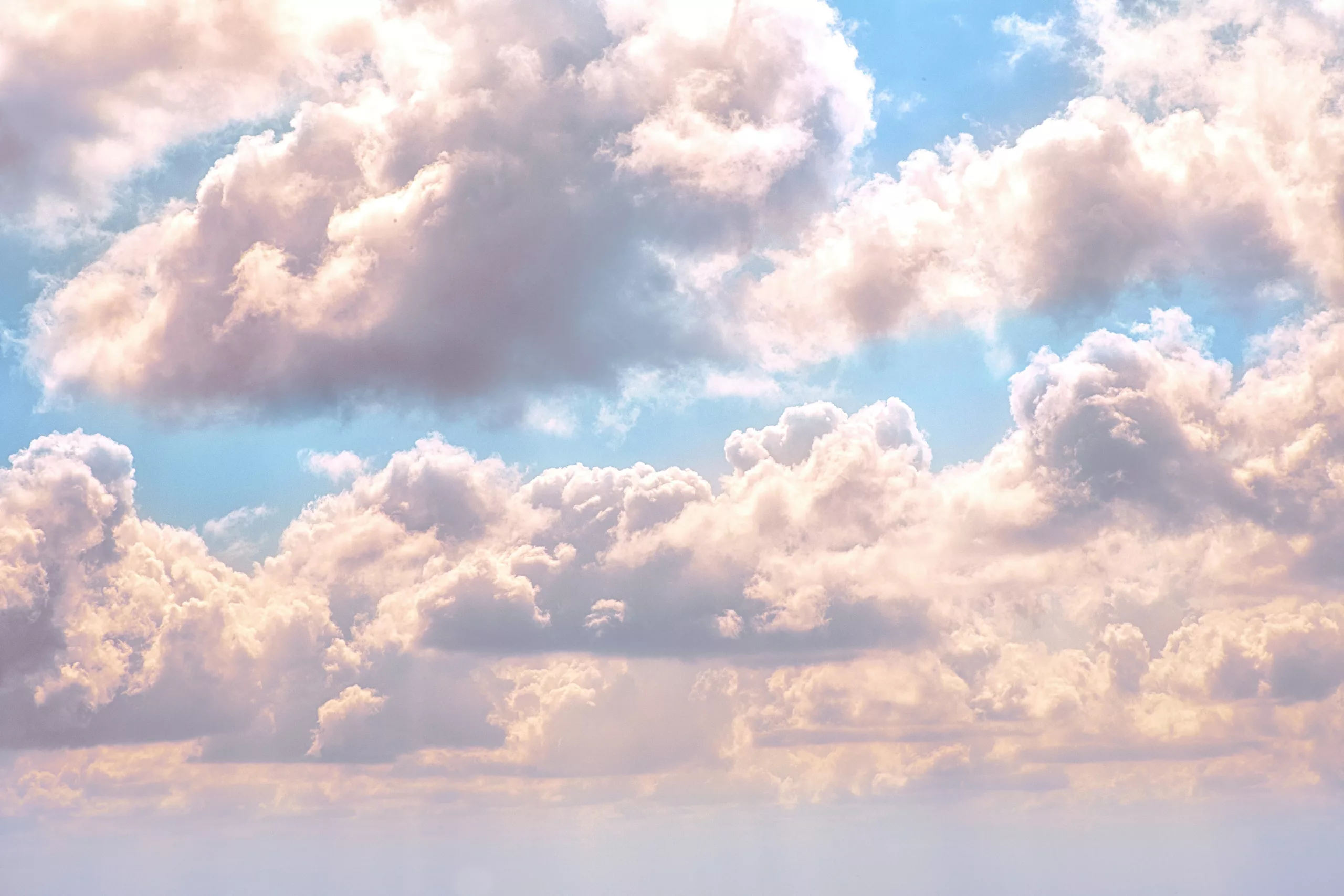 Soft pastel clouds in a calm sky