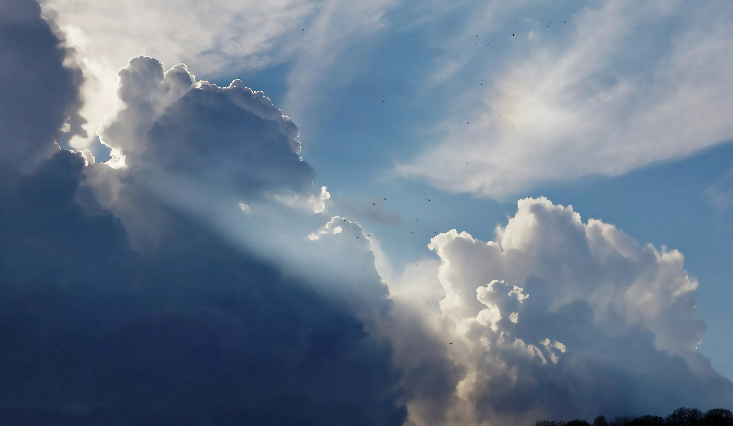 Sun rays breaking through storm clouds