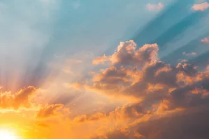 Sunset sky with clouds and rays