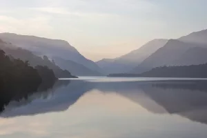 Mountain near body of water during daytime