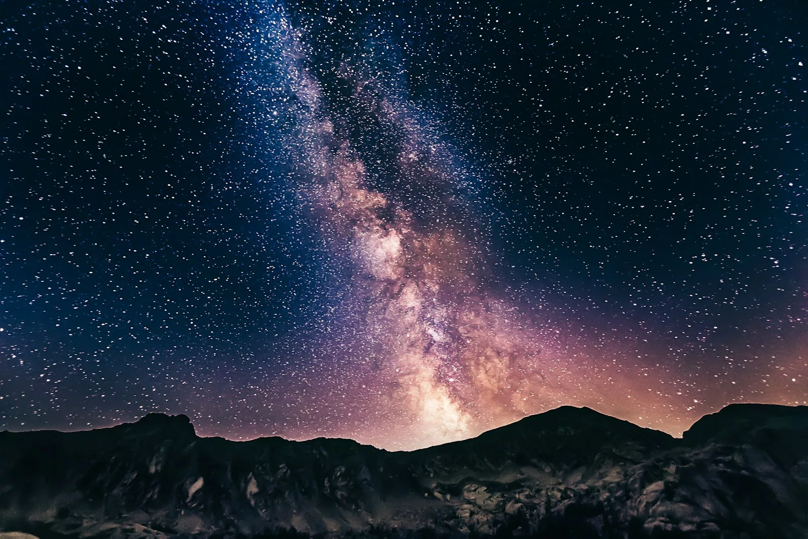 The Milky Way over a mountain silhouette